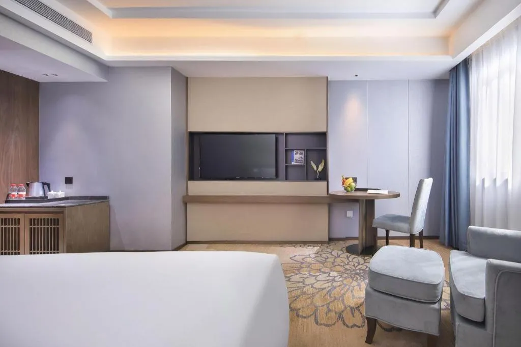 Bed in Vienna Hotel Guangxi Guilin 7-Star Wanda Plaza