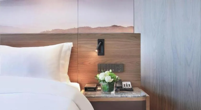 Bed in Vienna Hotel Guangxi Guilin 7-Star Wanda Plaza