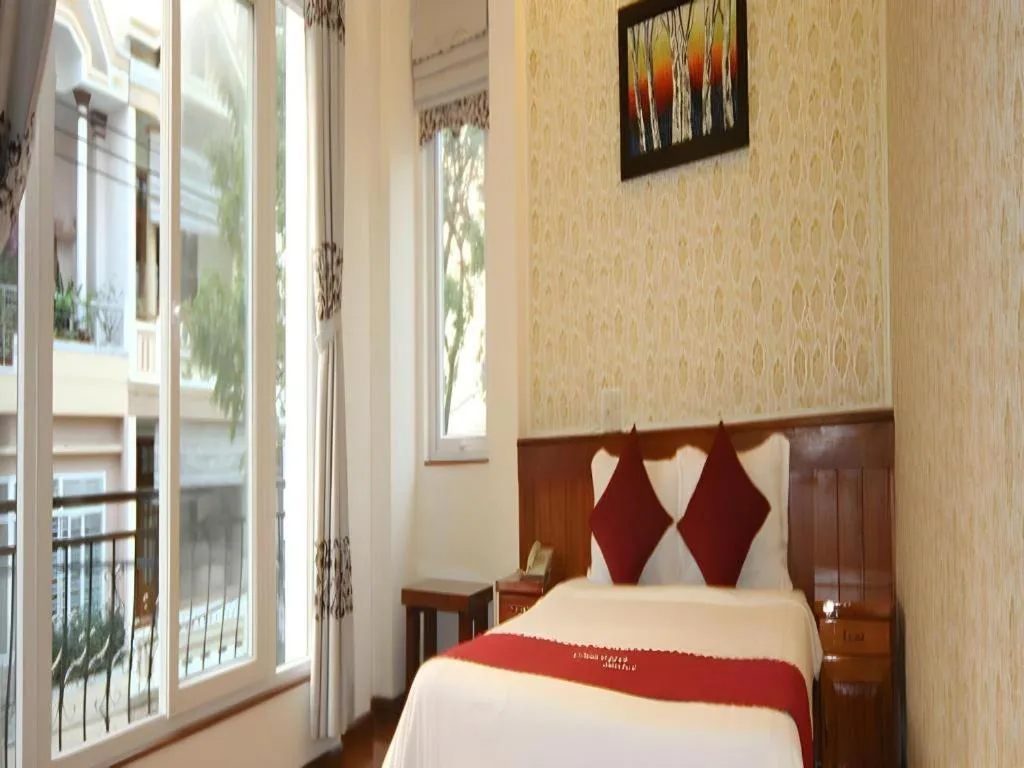 Bed in Omega Da Nang Beach Hotel