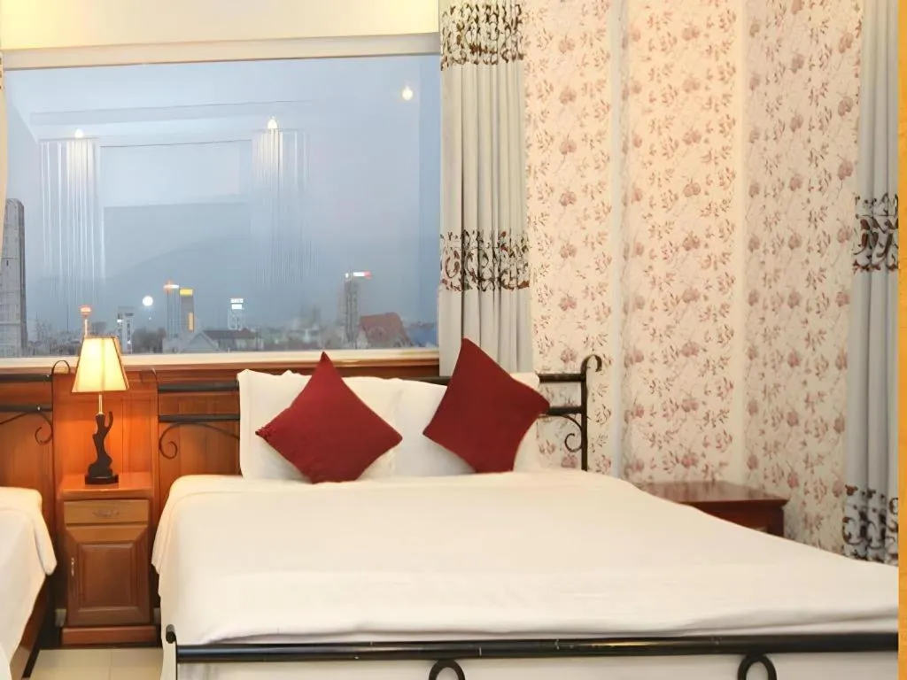 Bed in Omega Da Nang Beach Hotel