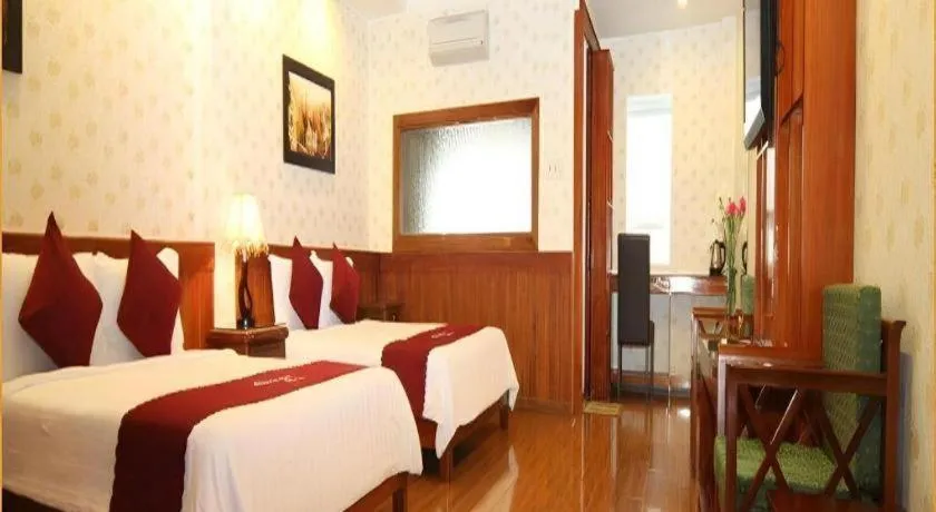 Bed in Omega Da Nang Beach Hotel