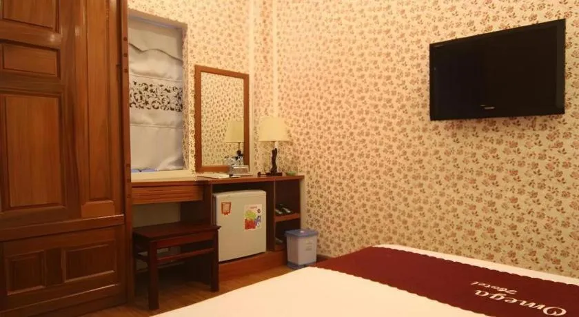 Bed in Omega Da Nang Beach Hotel