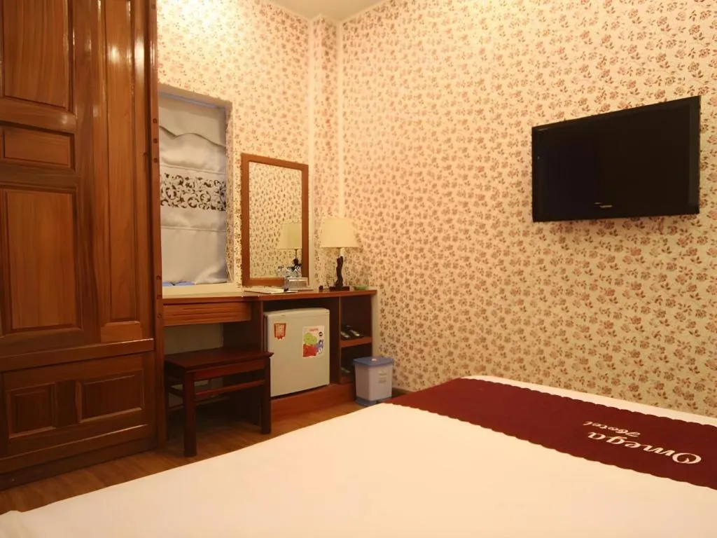 Bed in Omega Da Nang Beach Hotel