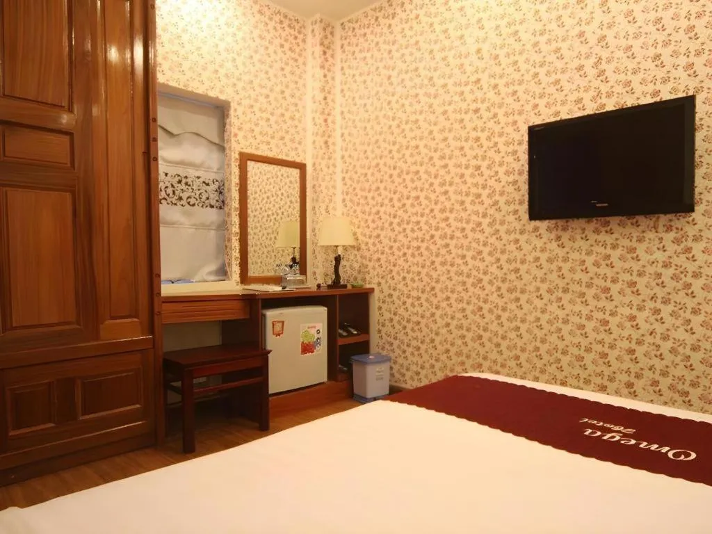 Bed in Omega Da Nang Beach Hotel