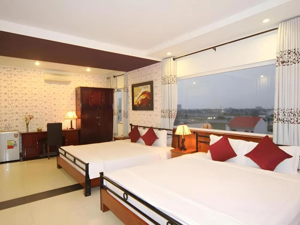 Bed in Omega Da Nang Beach Hotel