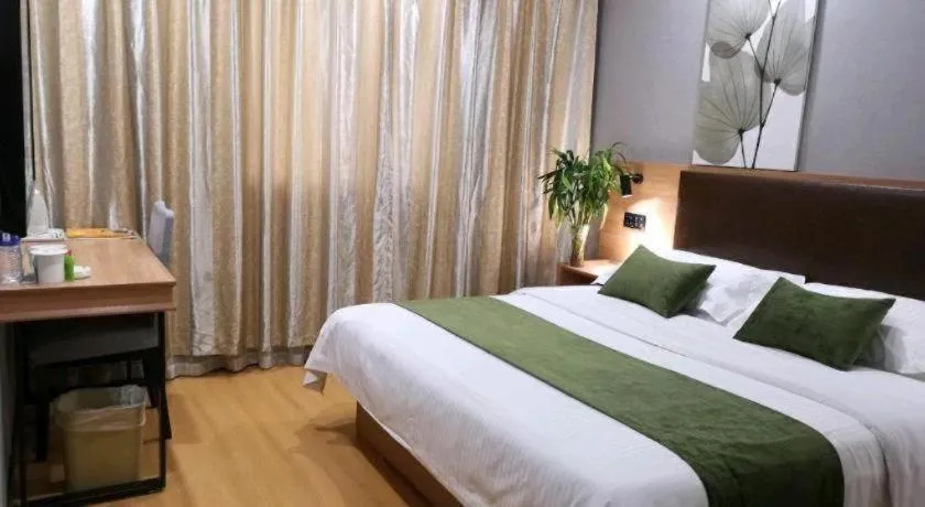Bed in GreenTree Inn Yixing Zhangzhu Express Hotel