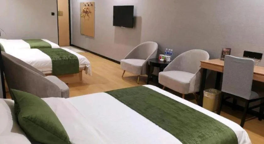 Bed in GreenTree Inn Yixing Zhangzhu Express Hotel