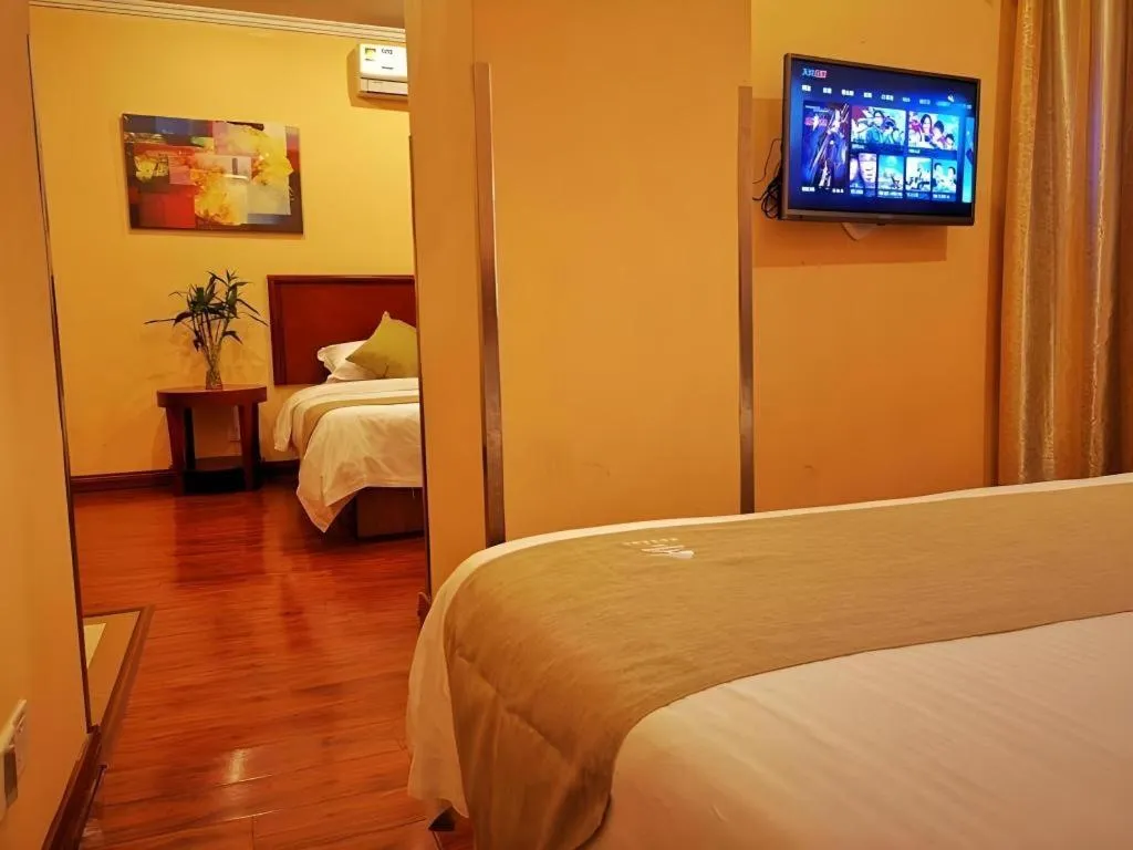Bed in GreenTree Inn Yixing Zhangzhu Express Hotel