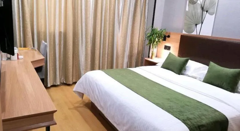 Bed in GreenTree Inn Yixing Zhangzhu Express Hotel