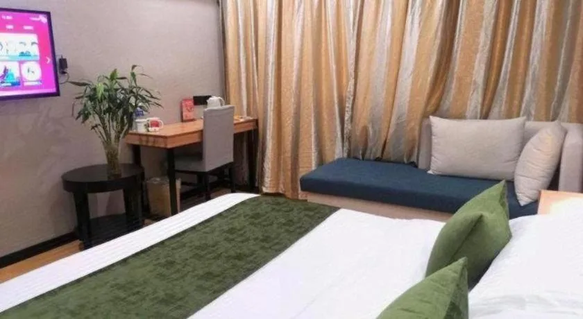 Bed in GreenTree Inn Yixing Zhangzhu Express Hotel