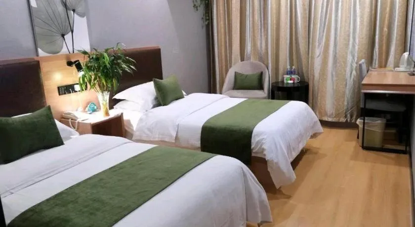 Bed in GreenTree Inn Yixing Zhangzhu Express Hotel