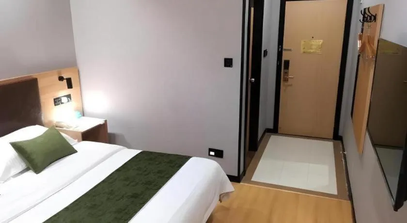 Bed in GreenTree Inn Yixing Zhangzhu Express Hotel