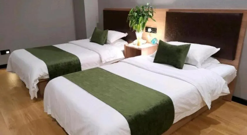 Bed in GreenTree Inn Yixing Zhangzhu Express Hotel