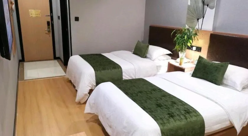 Bed in GreenTree Inn Yixing Zhangzhu Express Hotel