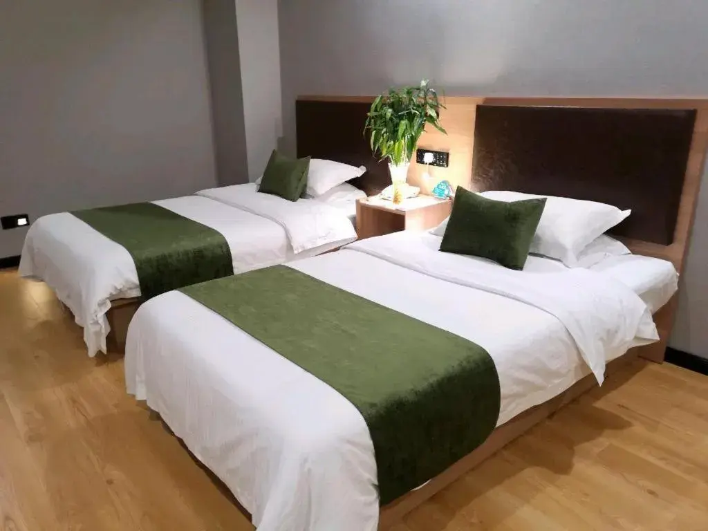 Bed in GreenTree Inn Yixing Zhangzhu Express Hotel Bed in GreenTree Inn Yixing Zhangzhu Express Hotel