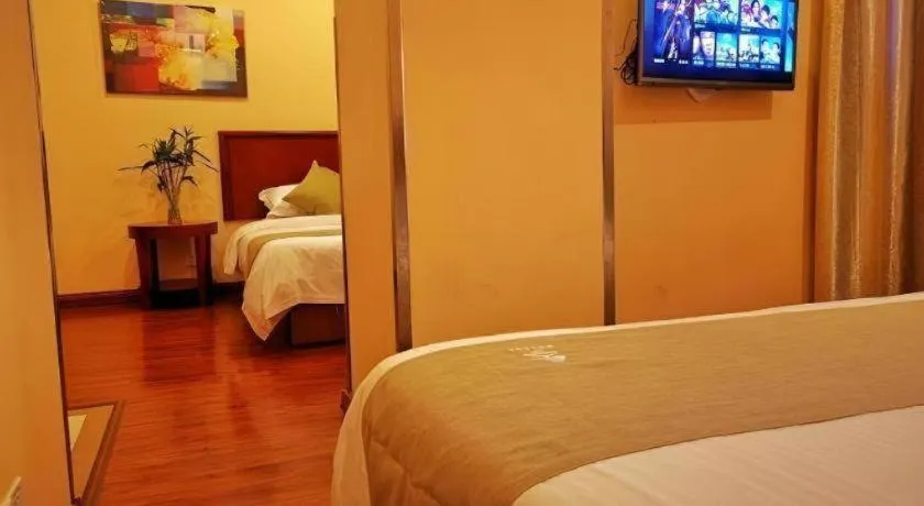 Bed in GreenTree Inn Yixing Zhangzhu Express Hotel