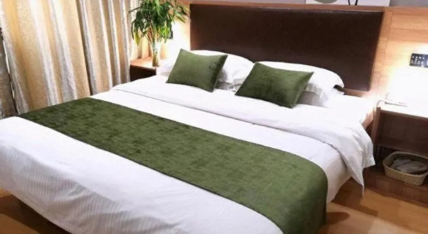 Bed in GreenTree Inn Yixing Zhangzhu Express Hotel