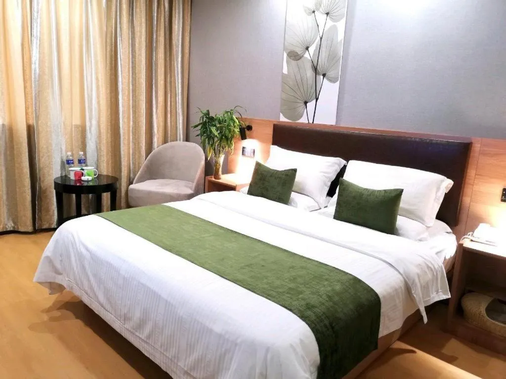 Bed in GreenTree Inn Yixing Zhangzhu Express Hotel