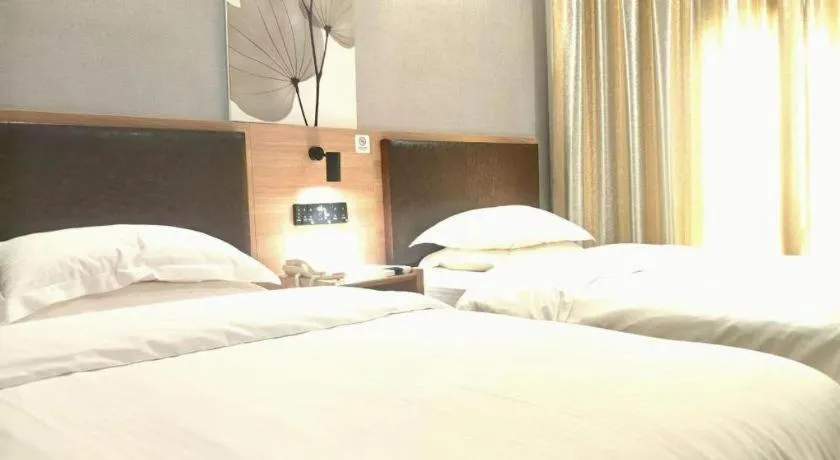 Bed in GreenTree Inn Yixing Zhangzhu Express Hotel