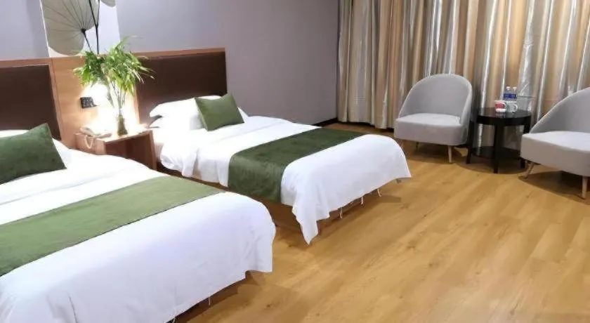 Bed in GreenTree Inn Yixing Zhangzhu Express Hotel
