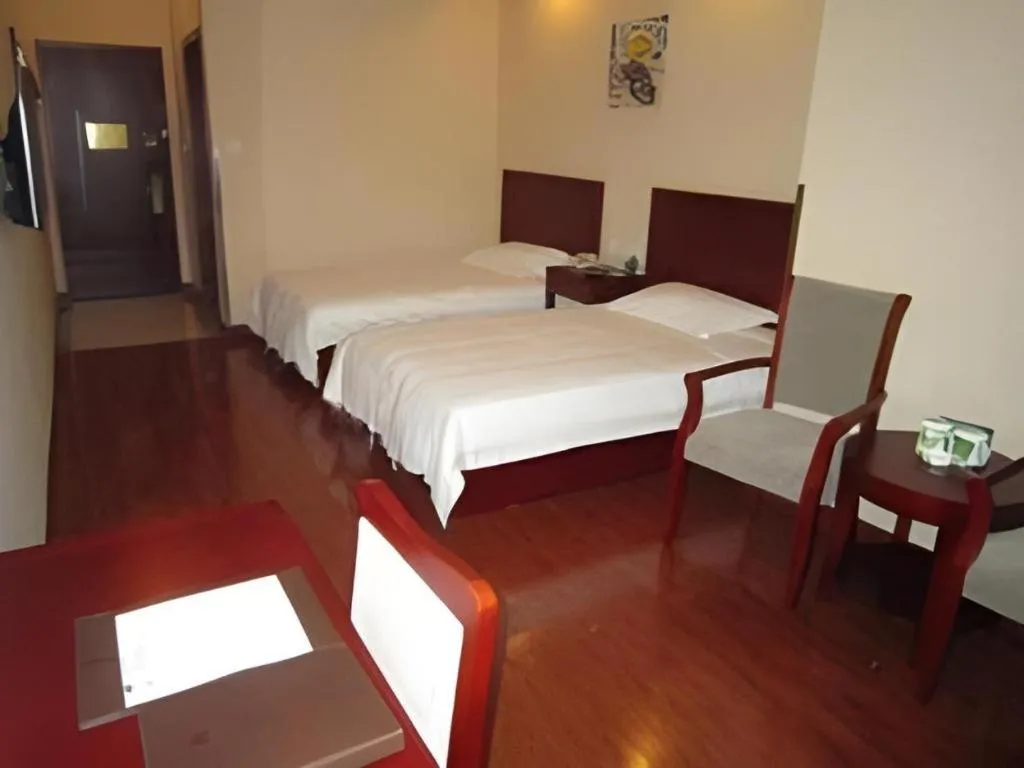 Bed in GreenTree Inn Yixing Zhangzhu Express Hotel
