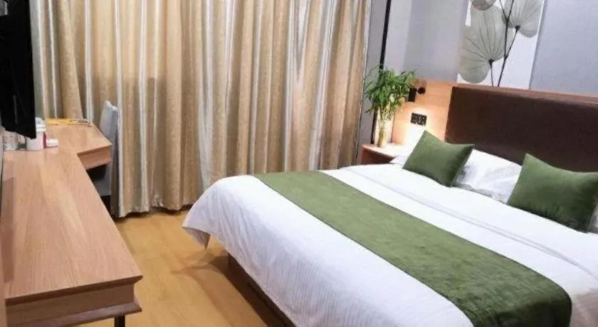 Bed in GreenTree Inn Yixing Zhangzhu Express Hotel
