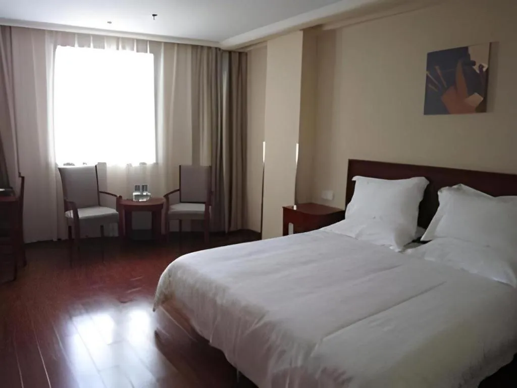Bed in GreenTree Inn Yixing Zhangzhu Express Hotel