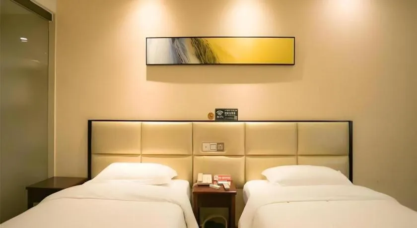 Bed in GreenTree Inn Guangzhou Panyu Bus Station Business Hotel