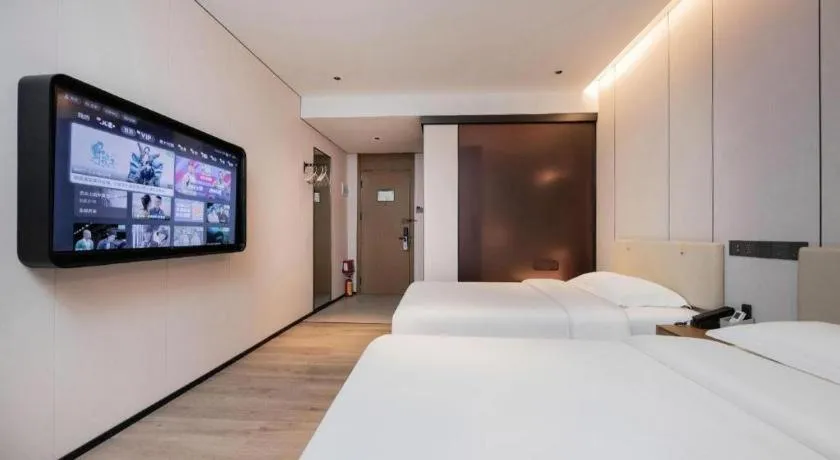 Bed in GreenTree Inn Guangzhou Panyu Bus Station Business Hotel