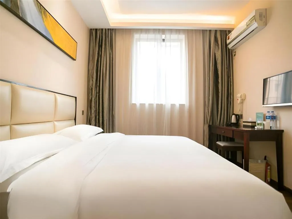 Bed in GreenTree Inn Guangzhou Panyu Bus Station Business Hotel