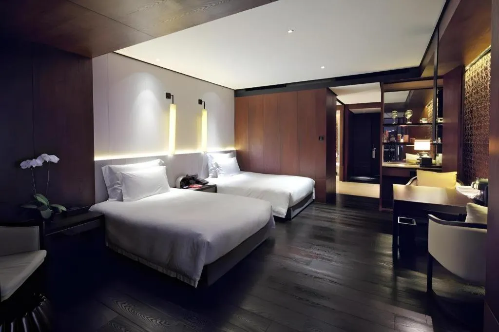 Bed in OCT Bay Breeze Hotel