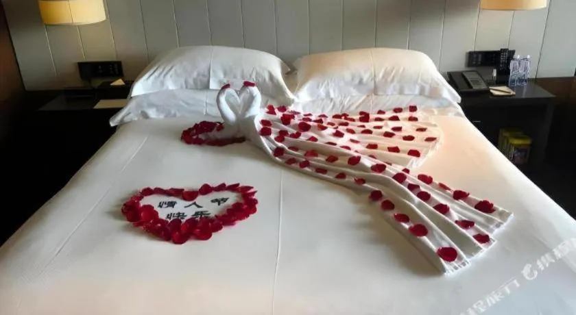 Bed in OCT Bay Breeze Hotel