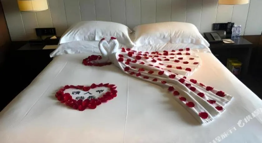 Bed in OCT Bay Breeze Hotel