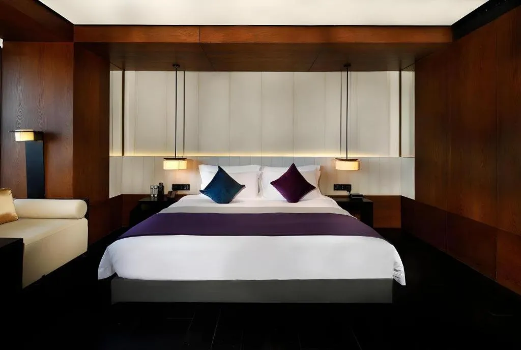 Bed in OCT Bay Breeze Hotel