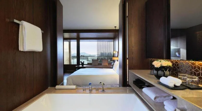 Bed in OCT Bay Breeze Hotel