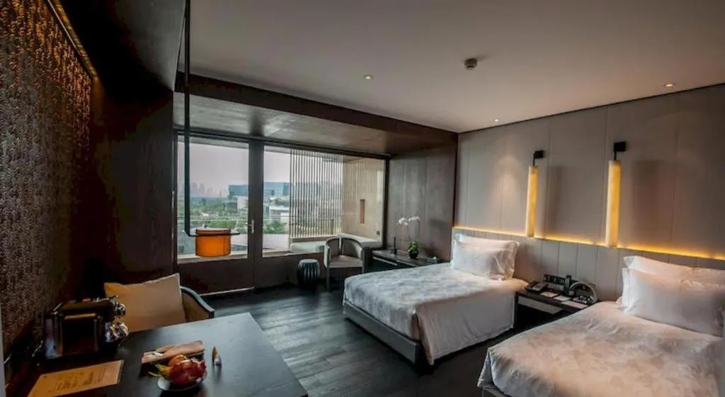 Bed in OCT Bay Breeze Hotel