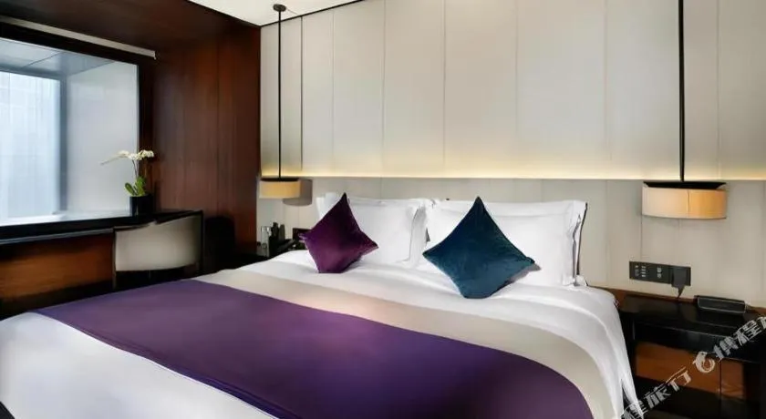 Bed in OCT Bay Breeze Hotel