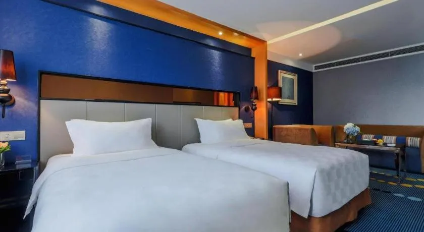 Bed in Grand Skylight Hotel KaiMei