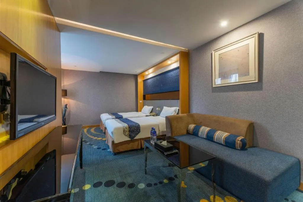 Bed in Grand Skylight Hotel KaiMei