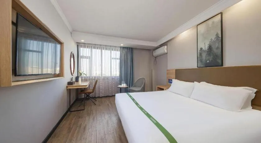 Bed in GreenTree Inn Jiaxing Tongxiang Tudian Express Hotel