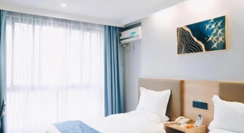 Bed in GreenTree Inn Jiaxing Tongxiang Tudian Express Hotel