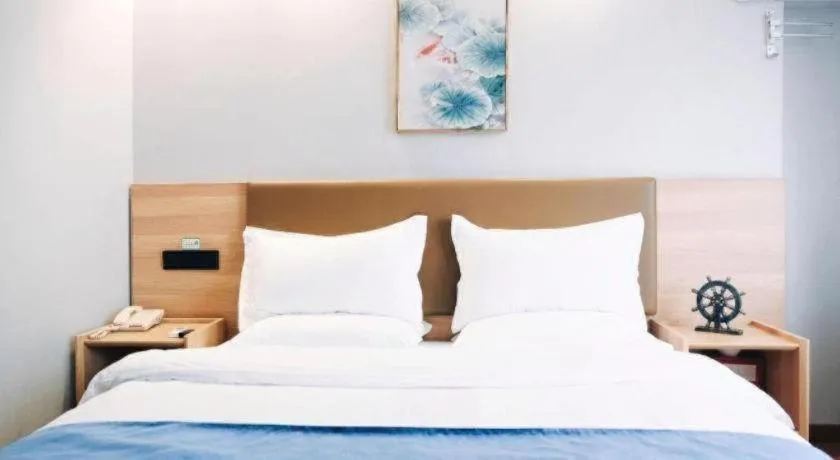 Bed in GreenTree Inn Jiaxing Tongxiang Tudian Express Hotel