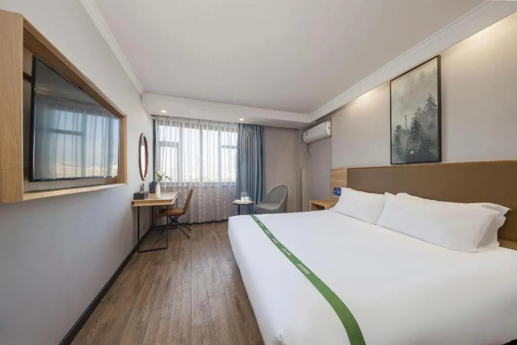 Bed in GreenTree Inn Jiaxing Tongxiang Tudian Express Hotel