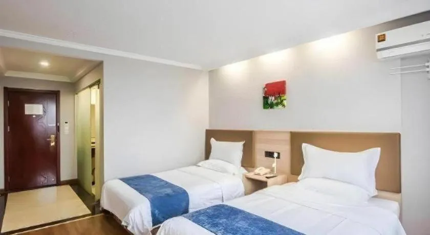 Bed in GreenTree Inn Jiaxing Tongxiang Tudian Express Hotel