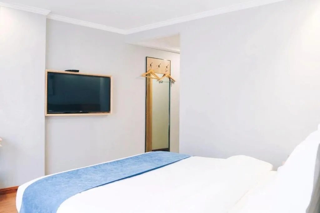 Bed in GreenTree Inn Jiaxing Tongxiang Tudian Express Hotel