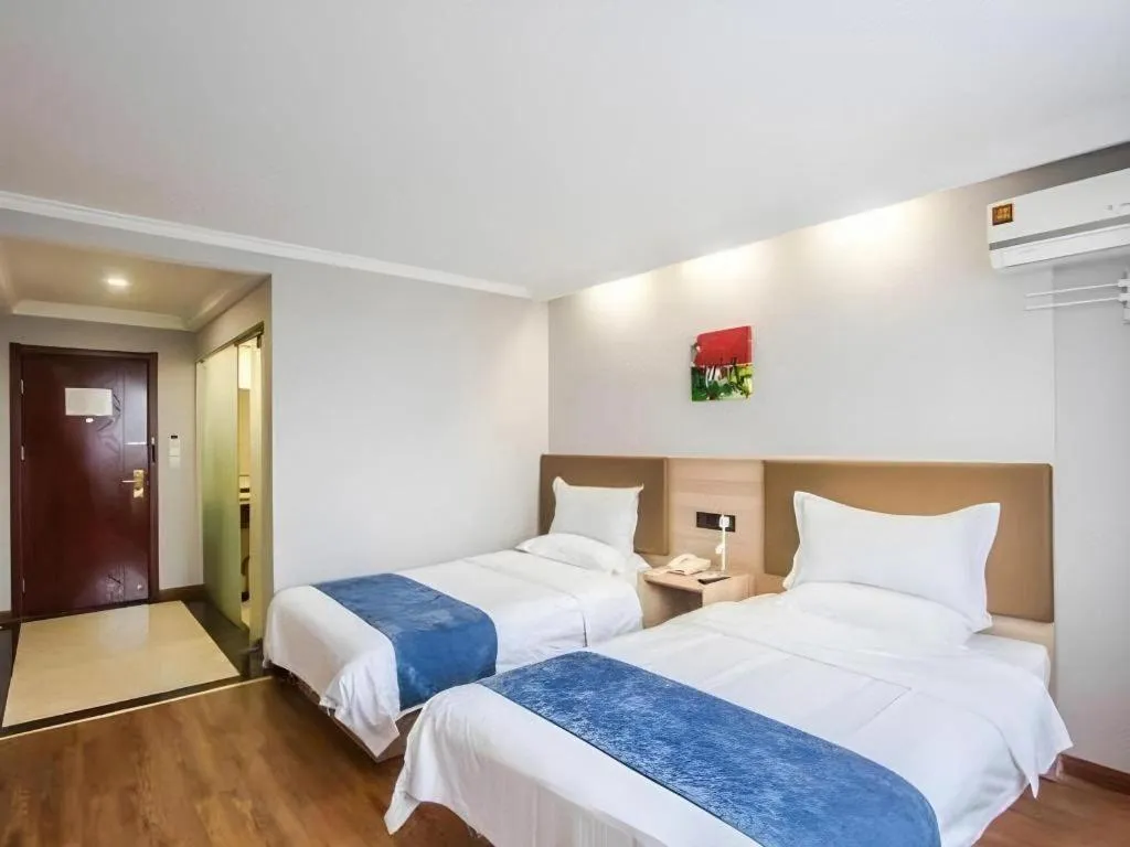 Bed in GreenTree Inn Jiaxing Tongxiang Tudian Express Hotel