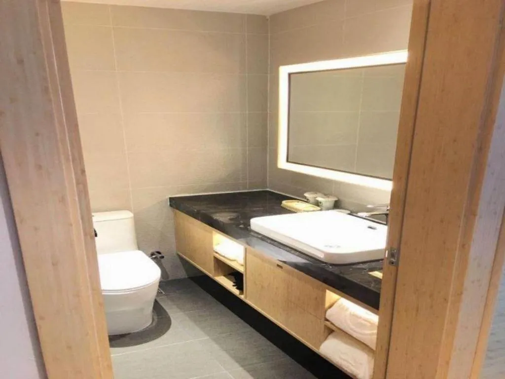 Bed in GreenTree Inn Lianyungang Suning Square Hualian Mantion Hotel