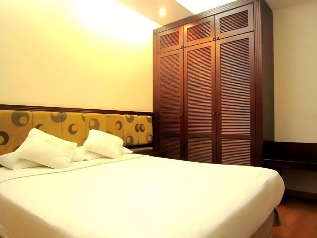 Bed in Golden Ant Hotels