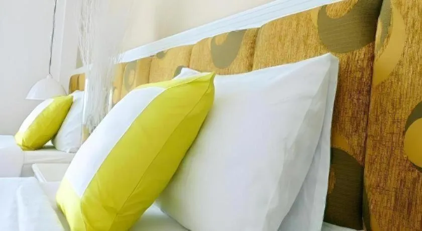 Bed in Golden Ant Hotels