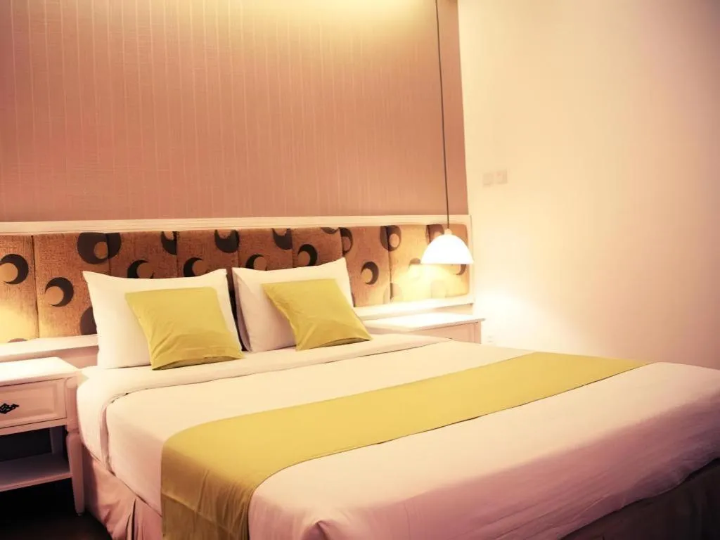 Bed in Golden Ant Hotels